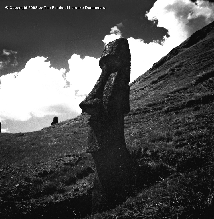 RRE_Angel_03.jpg - Easter Island. 1960. Moai on the exterior slope of Rano Raraku. Identified by Lorenzo Dominguez as "The Angel."  Photograph taken from the same angle as in one of Lorenzo Dominguez's drawings.